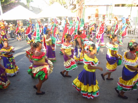 Dancers in colorful costumes during the Gran Parada de la Tradición, one of many parades throughout Carnaval